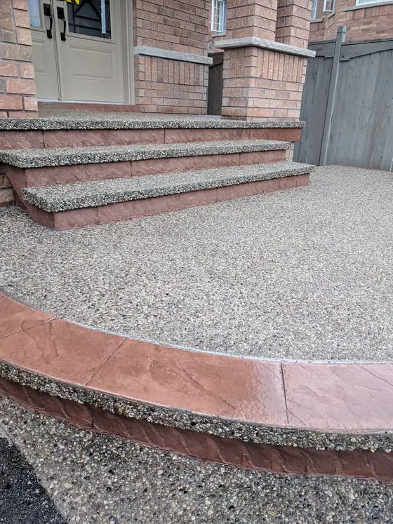 Exposed aggregate driveway and steps with coloured borders